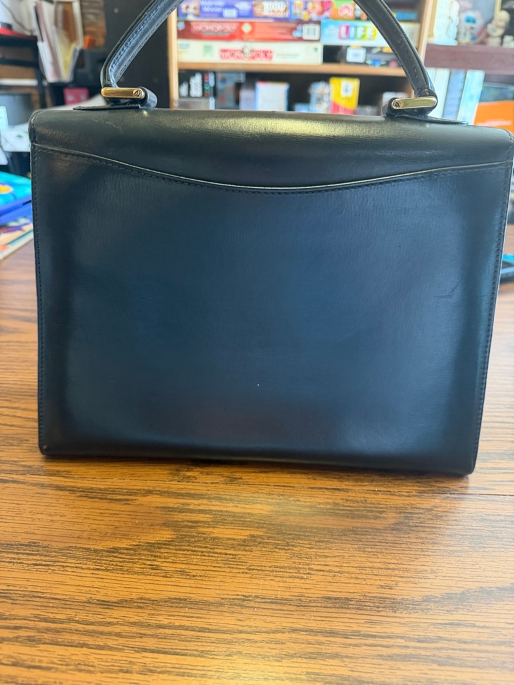Vintage Bally black leather handbag with gold-tone turn-lock closure. - Picture 9 of 14